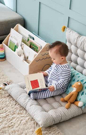Toddler reading a book