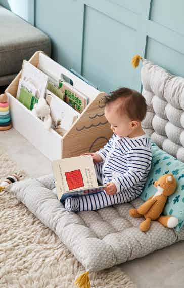Toddler reading a book